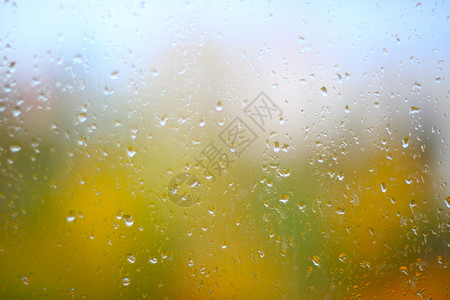 秋雨黄色窗户玻璃橙子雨滴图片