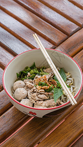 亚洲白面绿色蔬菜白色午餐食物筷子街道文化美食猪肉图片