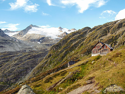 冰川山上的高山高丘陵屋 苏维采兰阿尔卑斯山爬坡草地顶峰自由旅行地面高山晴天冰川远足图片