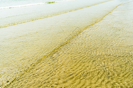 沙滩上透明的水波浪轨海洋白色热带液体风景波纹场景地平线海浪阳光图片