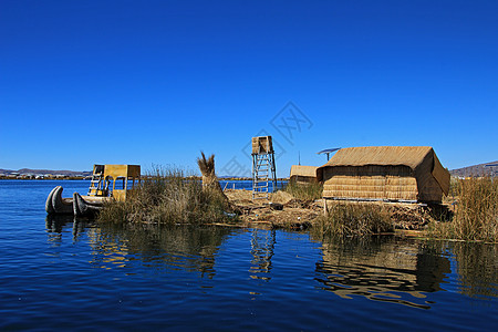 漂浮群岛 Uros 秘鲁提喀卡湖岛屿旅行独木舟芦苇旅游工艺木头蓝色村庄天空图片