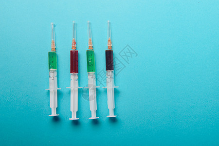 注射针筒在蓝色背景女性抗体医院诊所液体塑料外科医生治疗剂量图片