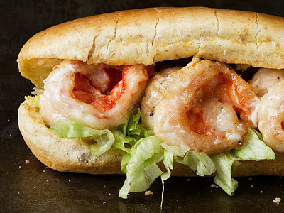 美洲养虾和捕虾男孩三明治小男孩垃圾食物对虾水平男生面包海鲜图片