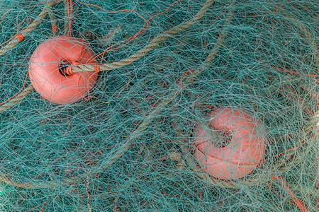 捕鱼渔网海洋红色漂浮港口尼龙航海绳索漂浮物码头图片