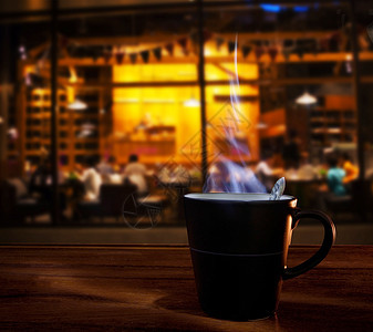 咖啡厅店铺木桌上的热咖啡杯用于食品a图片