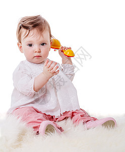 女孩玩响铃地毯好奇心孩子幸福裤子工作室婴儿毛皮儿童粉色图片