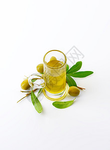 橄榄油黄色玻璃杯玻璃树叶水果液体器皿静物美食食物图片