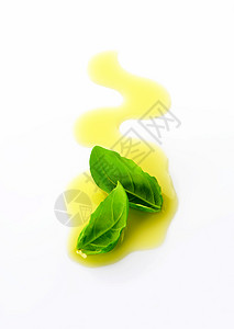 橄榄油细雨和叶树叶叶子食物烹饪液体美食药草黄色健康背景图片