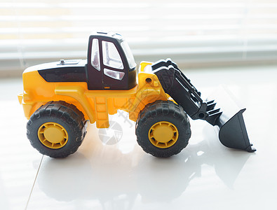 特写玩具轮装入器推土机倾倒装载机运输施工承包商卡车拆除搬运工道路图片