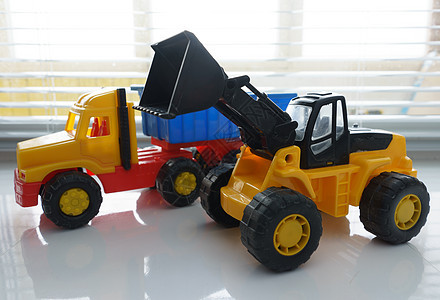 玩具车和玩具倾卸卡车推土机施工运输道路机器搬运工挖掘机机械前端童年图片