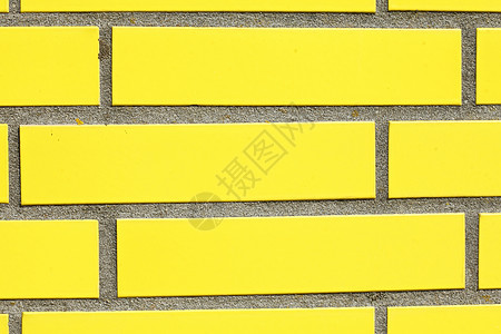 黄墙建筑石墙房子混合物黄色砖块关节石头积木砖墙背景图片