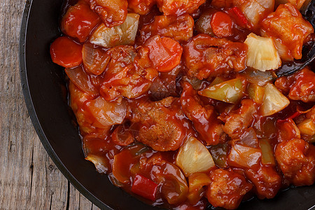 甜和酸猪肉午餐胡椒红色食物绿色炒锅菠萝洋葱烹饪油炸图片