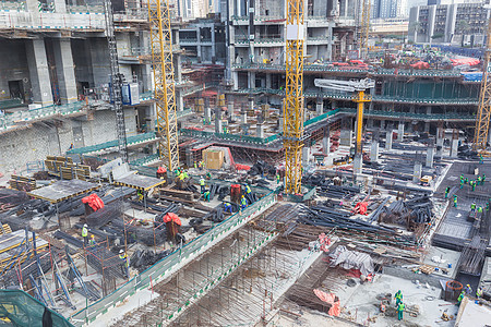 现代建筑物凝聚现场工程劳动者摩天大楼城市地面建设者机械水泥基金会团队工作服图片