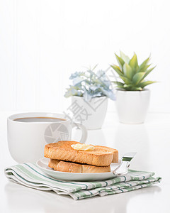 吐司和咖啡植物棕色杯子营养小吃盘子黄油面包早餐图片
