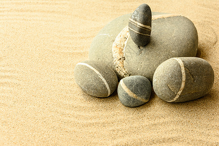 沙石黄色灰色风景金子杂色海岸团体阳光石头海滩图片