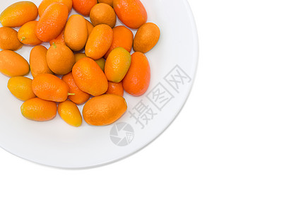 白色盘子上的Kumquat 特写光背景果园椭圆形收成植物维生素水果食物农业金橘图片