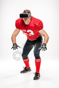 虚拟现实耳机中的足球运动员男性肌肉头盔行动联盟技术运动活力运动装橄榄球图片