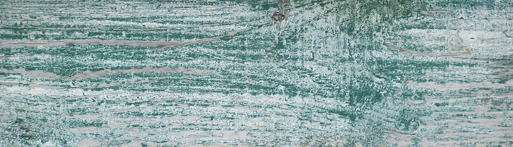 磨损的白色风化油漆 底下有绿色芯片剥皮乡村苦恼裂纹裂缝衰变古董木板木头图片