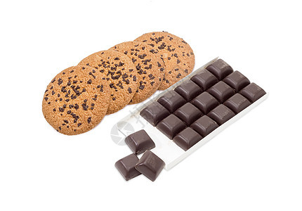 巧克力薯片饼干和黑巧克力 在光背景上吃图片