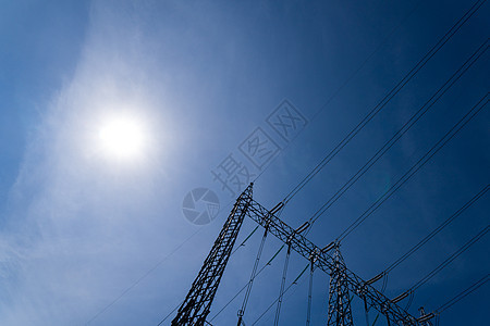 高压电塔阳光标志技术日落电缆黑色电源线蓝色钢缆力量图片