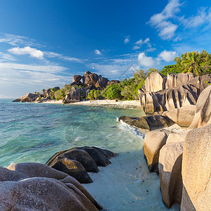 塞舌尔La Digue岛阿根廷热带海滩美丽的Anse源棕榈旅行天空巨石岩石阳光石头日出天堂假期图片
