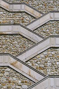 通往城堡的楼梯防御摇滚石头岩石栏杆背景军事建筑学工事风化图片