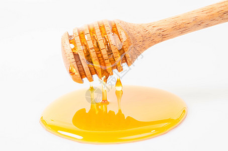 蜜糖用蜂棒滴水液体跑步金子白色蜜蜂水坑勺子糖浆食物蜂窝图片
