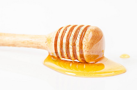 蜜糖用蜂棒滴水糖浆饮料勺子液体养蜂人跑步食物木头蜂窝白色图片