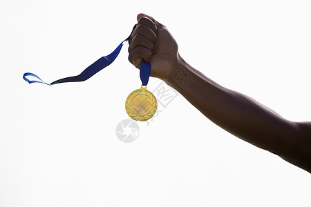 拥有金牌运动员的手播放器竞赛能力成就勋章荣誉胜利金属运动奖章图片