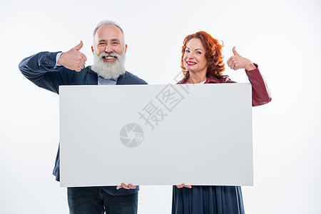 持有空白卡的夫妇手势卡片胡子微笑夫妻头发友谊中年两个人白色图片