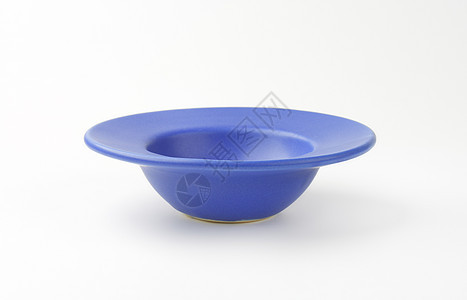 深蓝色板盘子陶器圆形蓝色餐具背景图片
