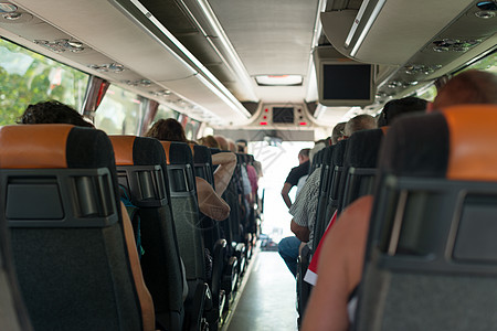 从巴士里看到乘客 校对 Portnoy假期座位运输空调观光路线电视旅游服务城市图片