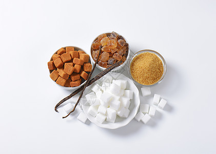 各种糖类糖类食物白色冰糖静物高架蔗糖肿块水晶棕色图片