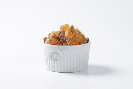 褐岩糖晶体盘子水晶味道焦糖棕色琥珀色食物肿块糖果背景图片