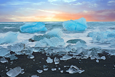 冰岛Jokulsarlon的黑沙滩冰石岩石海洋海滩石头日落黑沙海浪黑色图片