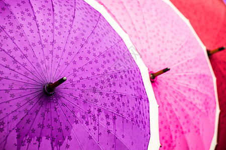 传统的亚洲雨伞魅力旅行装饰品情调工艺阳伞织物工作橙子螺旋图片