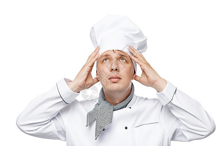 年轻厨师用白色背景调整头顶的帽子图片