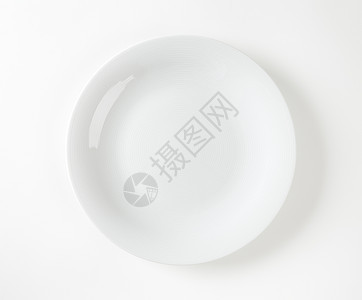 平滑的白餐盘白色陶器高架餐盘圆形轿跑车板盘子餐具图片