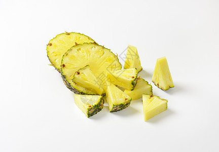 新鲜菠萝切片和网食物水果情调热带楔子小吃绿色黄色异国图片