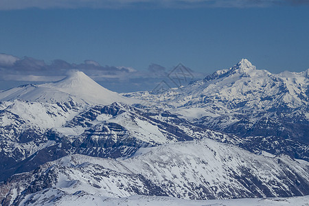 智利的雪山假期岩石旅行火山日落白色顶峰天空图片