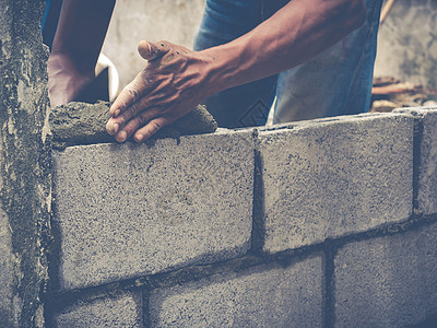砖砖建工是建筑墙壁建筑学石匠石工工人石头男人房子水泥建设者瓦工图片
