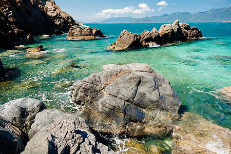 蓝色海洋环礁湖海滩异国海洋旅行天空海岸线旅游情调海岸海景石头图片