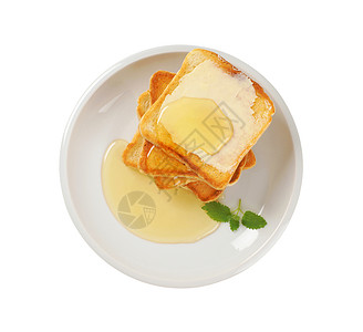含黄油和蜂蜜的吐司面包面包早餐团体高架食物图片