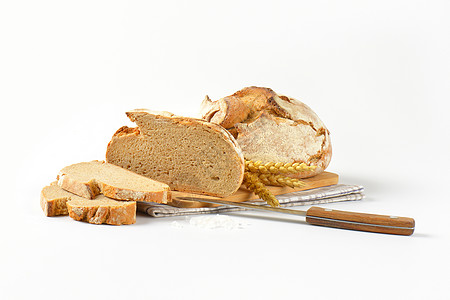新鲜的结壳面包工匠谷穗食物圆形横截面麦穗面包棒硬皮图片