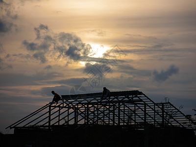 日落时建家房子建设者工具子公司男性橙子建造工人建筑学男人图片
