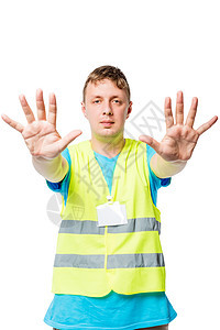身穿背心的男子举起手来 在白色背景上施展停止的手势图片