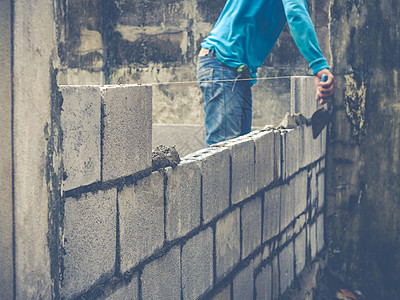 砖砖建工是建筑墙壁男人石工石匠石头建设者建筑学工匠水泥房子砖块图片