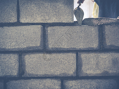 砖砖建工是建筑墙壁瓦工工匠石头工人石工水泥砖块建设者男人石匠图片