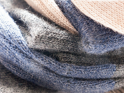 由棉毛制成的暖软袜子温暖宏观纤维工作室侧射光线羊毛衣服棉布图片
