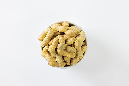 罐壳中的生花生食物豆荚高架小吃豆类种子花生图片